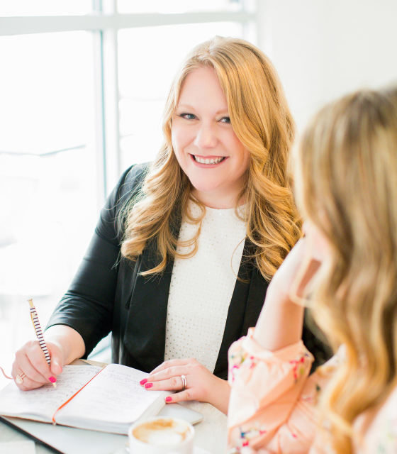 Best Wedding Planner - Blonde Woman Smiling At Another Woman At Desk